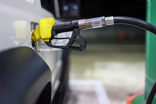istock Pumping gasoline fuel in car 2211871552
