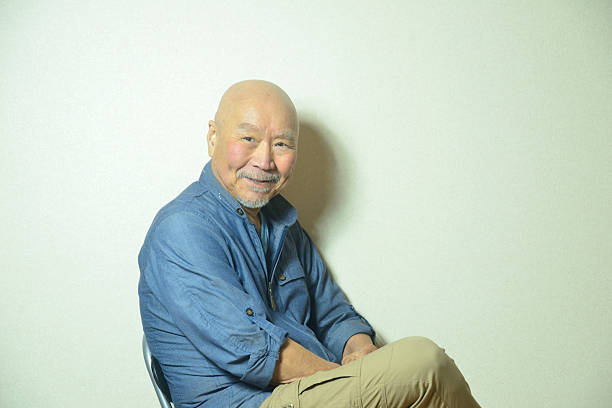 istock An old man expressing emotions with a smile 2211873853