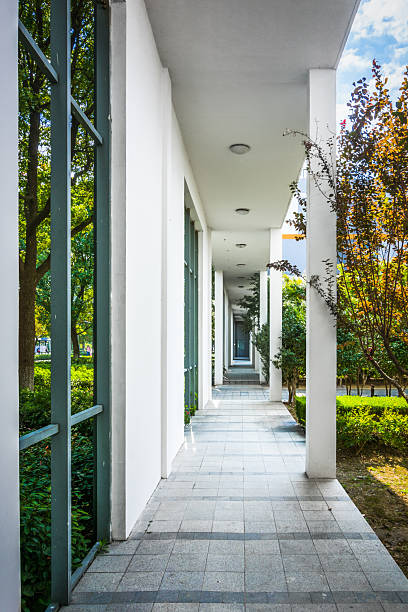 istock Tranquil Walkway: A Modern Architectural Perspective in Urban Landscape 2211875308