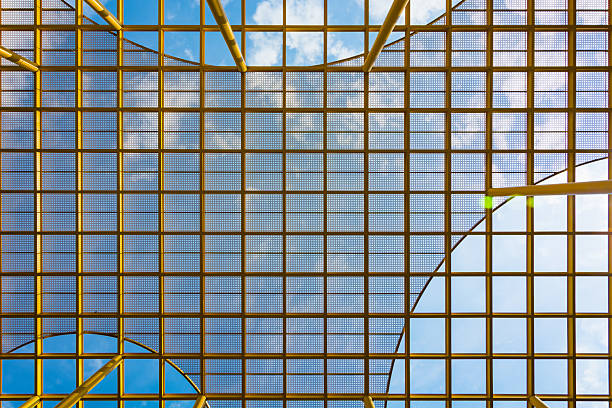 istock Captivating Perspective of a Modern Architectural Grid Against a Bright Blue Sky 2211875325