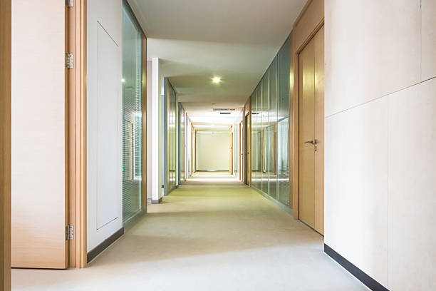 istock Captivating Modern Hallway with Glass Walls and Warm Lighting 2211875340