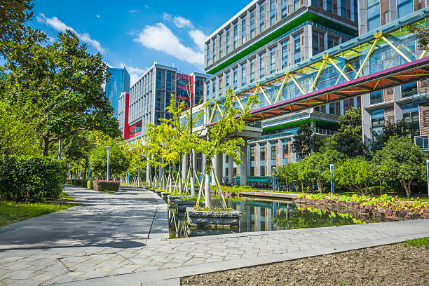 istock Vibrant Urban Parkscape with Modern Architecture and Scenic Walkway 2211875344