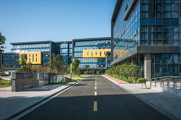 istock Modern Architectural Design Showcasing Glass and Greenery in a Vibrant Urban Setting 2211878387