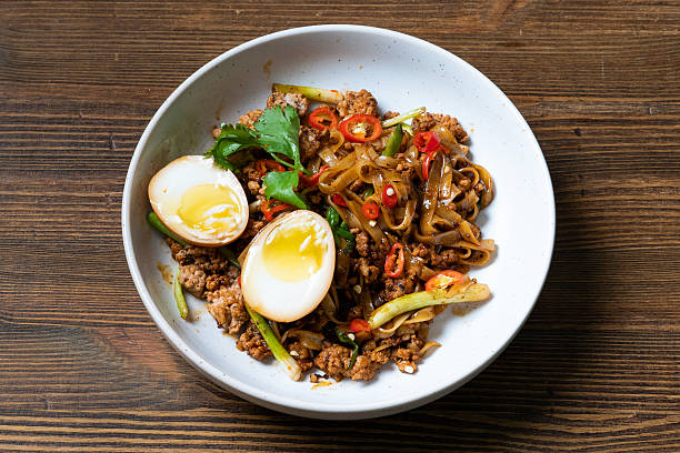 istock Savory Noodles with Spiced Meat and Egg 2211879326