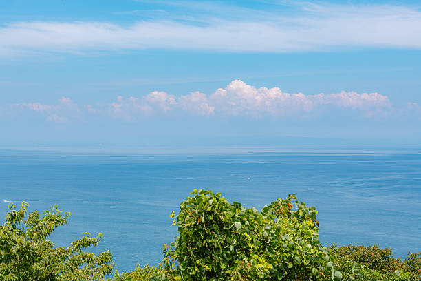 Ocean Horizon Under Summer Sky and White Clouds