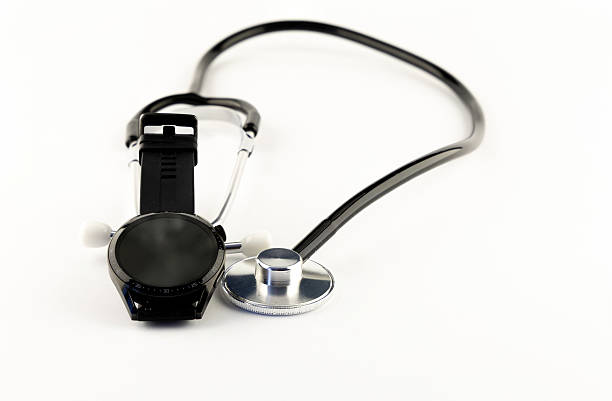 istock Medical stethoscope and black electronic watch on white background 2211880042