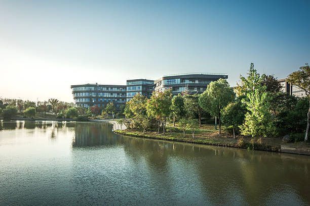 istock Tranquil Lakeside Scene Featuring Modern Architecture Amidst Lush Greenery 2211880490