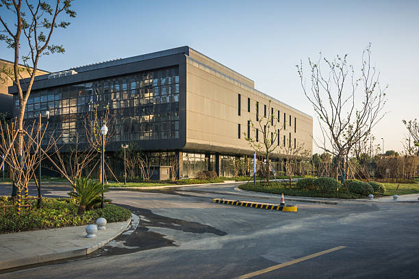 istock Modern Architectural Marvel: Eco-Friendly Building Surrounded by Lush Landscapes 2211880503