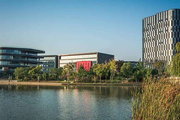 istock Tranquil Reflection of Modern Architecture by the Serene Lakeside 2211880509