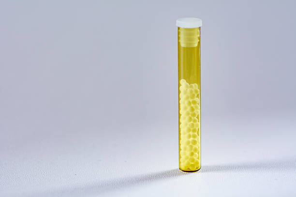 Product photo of homeopathic pills in transparent glass tubes