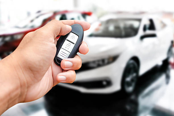istock A hand holds a car key fob or car remote keyless entry 2211884552