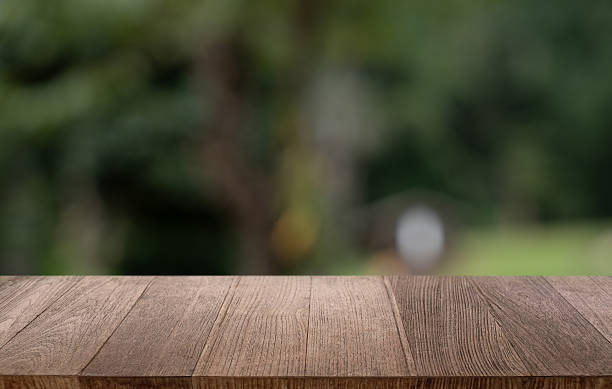 istock Empty wood table top and blur of restaurant background selective focus product display 2211886846