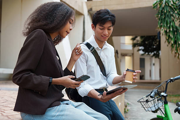 istock Digital Solutions and Sustainable Practices. Friends utilize technology to enhance their eco-friendly lifestyle. 2211889446