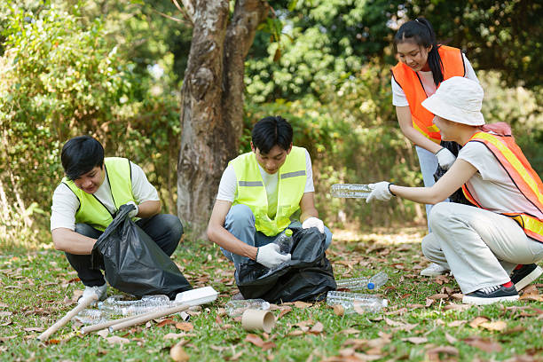 istock Community Initiative for Park Cleanliness and Sustainability. Volunteers sorting recyclables while promoting environmental responsibility. 2211892342