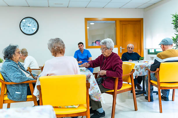 istock Elderly people playing and relaxing in nursing home 2211892930