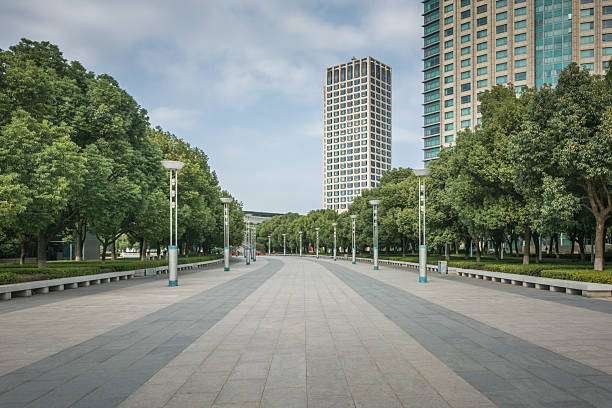 istock Serene Urban Pathways: A Tranquil Walk Through Lush Greenery and Modern Architecture 2211893213