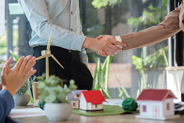 istock Trust and Partnership. Business professionals shaking hands to solidify agreements on sustainable initiatives. 2211893709