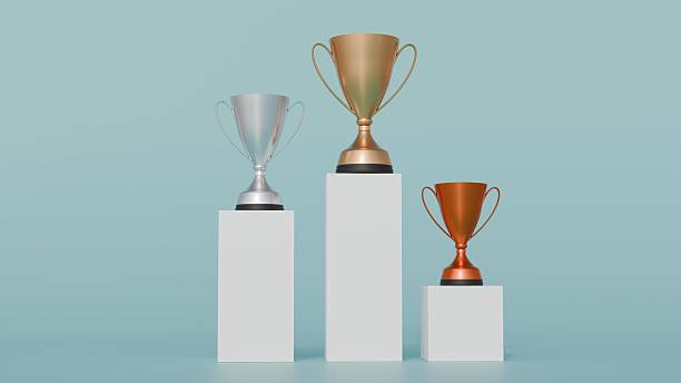 istock A contemporary design gold, silver, and bronze trophies 2211894940
