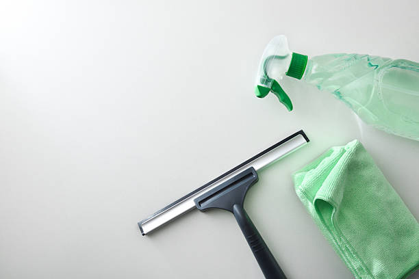 istock Window cleaner spatula, spray product and microfibre cloth on white 2211896115