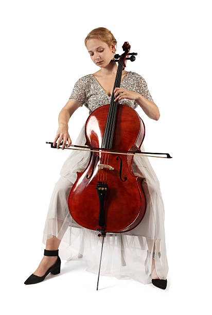 istock Beautiful young woman playing cello on white background 2211897217