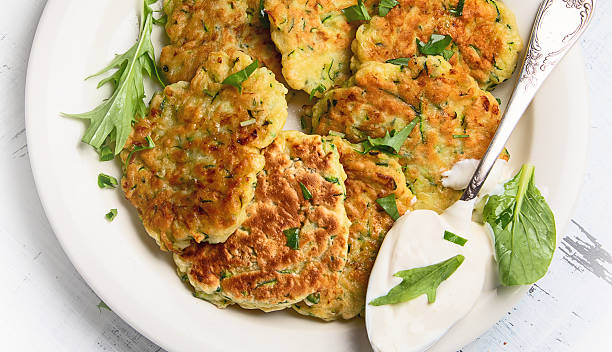 istock Zucchini fritters with sourcream. 2211897762