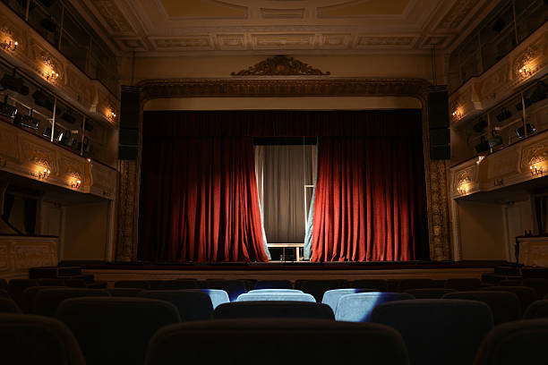 istock Theatre interior with stage and rows of comfortable seats 2211899070