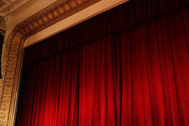 istock Elegant red curtains in theatre, low angle view 2211899122