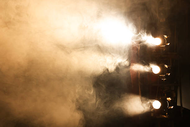 istock Professional spotlights and smoke on stage in theatre 2211899199