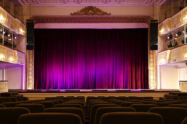 istock Theatre interior with stage and rows of comfortable seats 2211899396