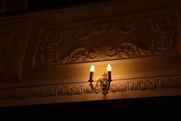 Vintage lamps on wall in theatre, low angle view