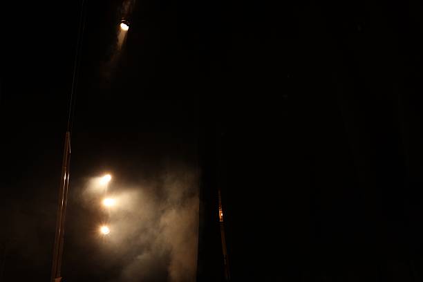 Massive fire burns at residential neighborhood under dark sky. The concept of fire hazard