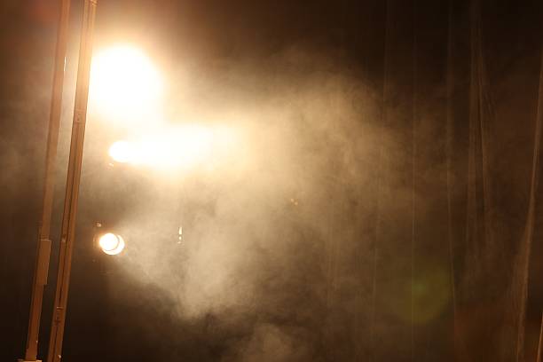 istock Professional spotlights and smoke on stage in theatre 2211899806