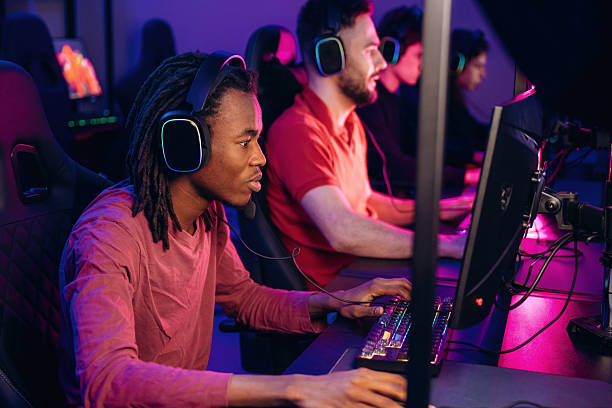 istock High end PC's, side view. Gamers are playing video game by computers 2211900266