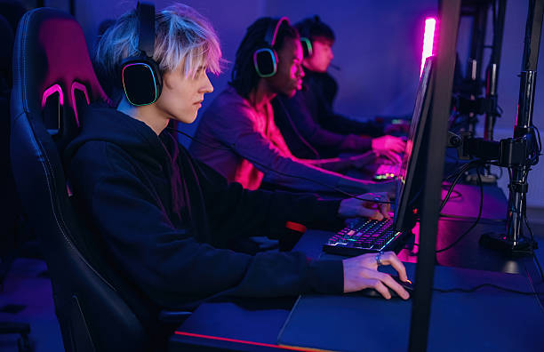 istock High end PC's, side view. Gamers are playing video game by computers 2211900395