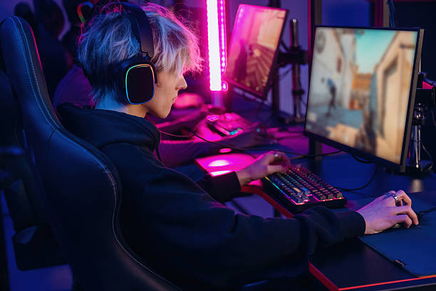 istock By high end PC. Gamers are playing video game by computers 2211900433