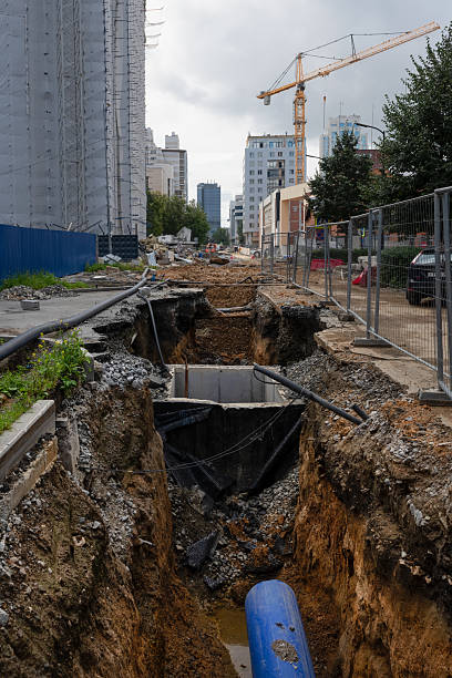 istock Work on laying new communications and an old sewer well 2211900807