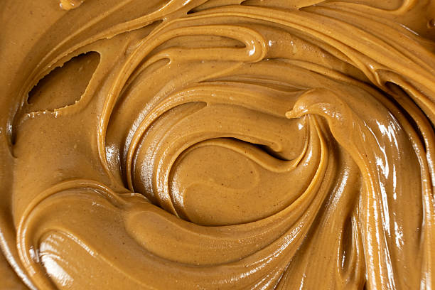 istock Smooth Nut Butter Swirl as Culinary Background 2211901124