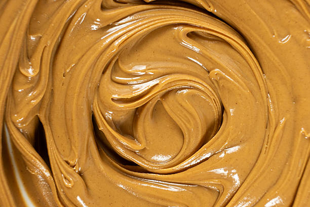 istock Creamy Texture American Natural Peanut Butter Top View Macro 2211901142