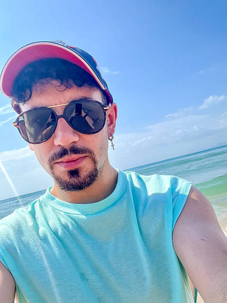 Young man enjoying summer holidays at the beach