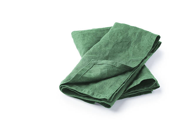 istock Green natural linen napkin cloth folded isolated on white background 2211902571
