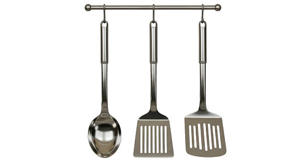 istock Isolated Kitchen Utensils Hanging on Steel Rack 2211903151