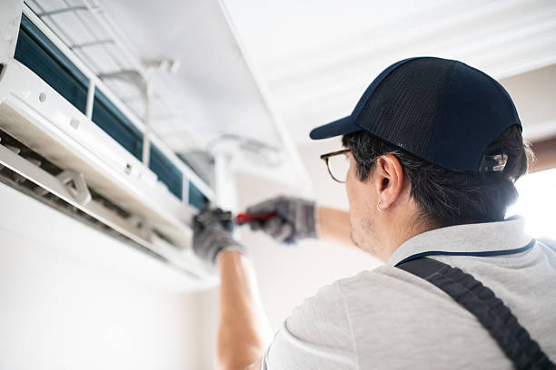 istock Technician with screwdriver repairing air conditioner at home 2211903237