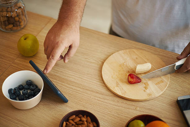 istock Preparing Fresh Fruit Salad with Blueberries and Strawberries 2211904331