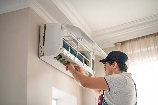 istock Technician repairing air conditioner at home 2211904869
