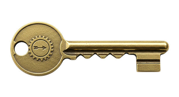istock Isolated Ornate Brass Key with Gear and Arrow Design 2211908187