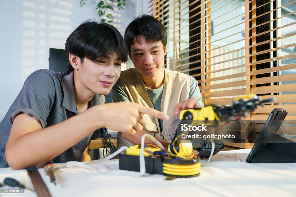 Boy Learning Tech Asian Boys Learn And Do The Experiment About Robotics Sciences And ...