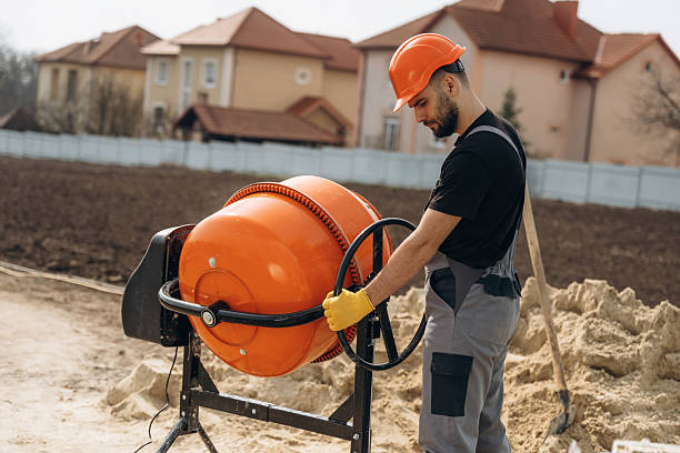 istock Man is working on the construction site with concrete mixer 2211910656