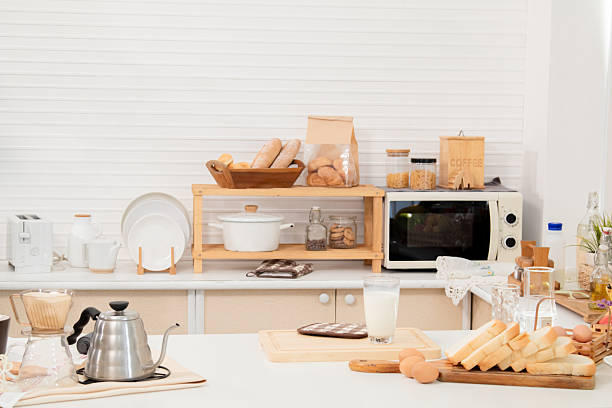 Creative professional multitask effortlessly as the morning sun, man focused gaze on laptop screen new project work from home, snapshot captures a modern lifestyle meets productive energy arrangement