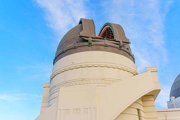 Los Angeles, California - December 14, 2024: Close-up view of the open dome at Griffith Observatory, showcasing its architectural design under a vibrant blue sky.