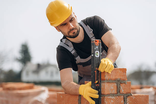 istock Setting up the right level with tool. Construction worker is at job with bricks outdoors 2211912735